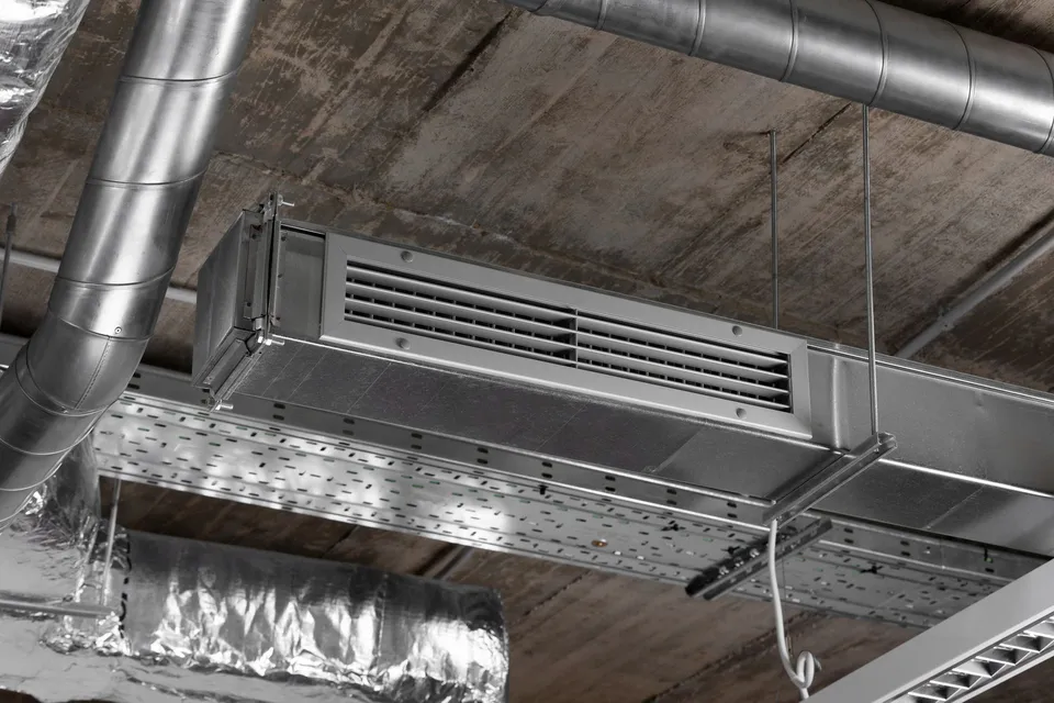 A close up of a ventilation system in a building.