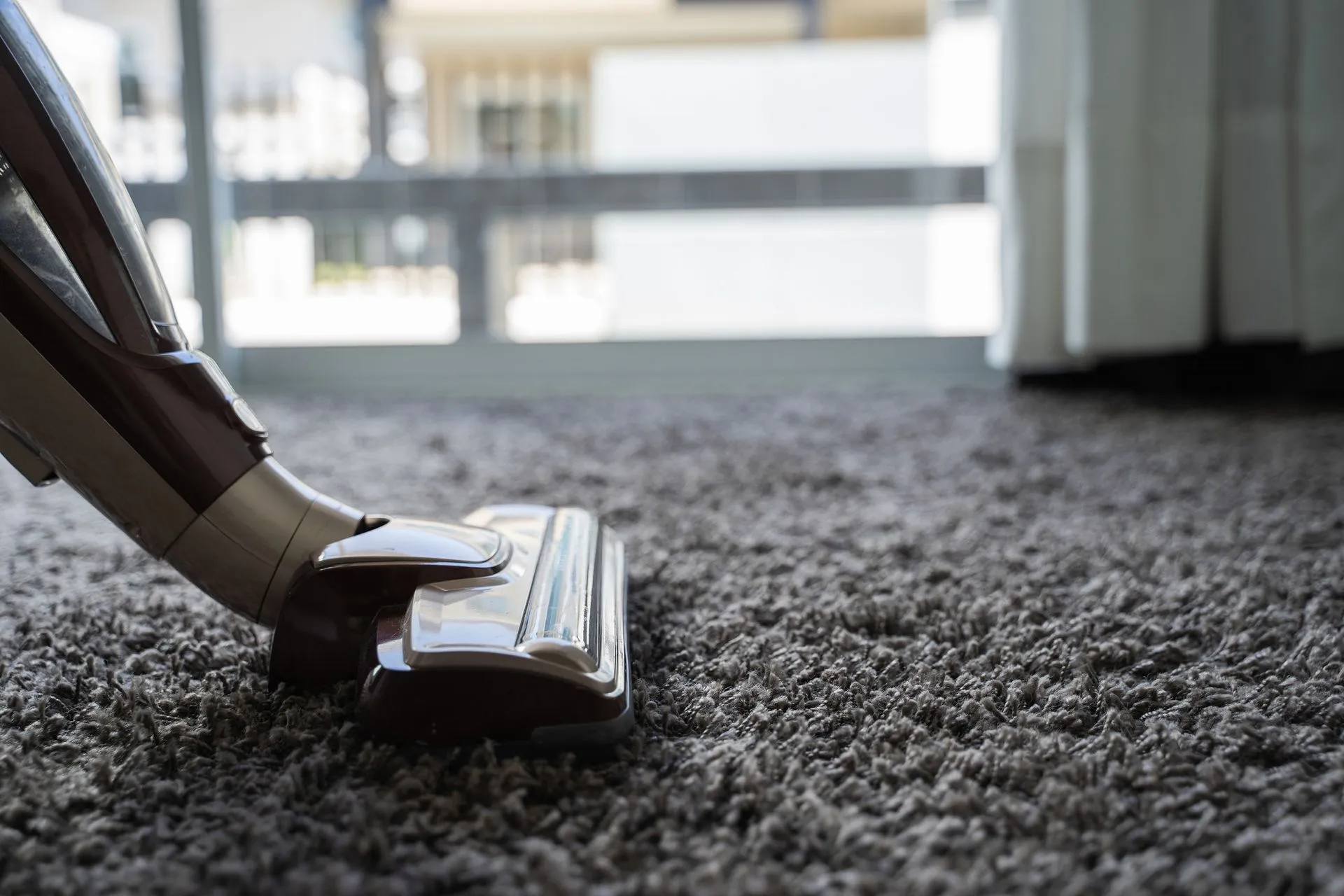 A vacuum cleaner is cleaning a carpet in Vancouver