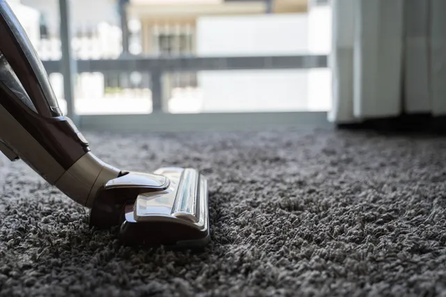 A vacuum cleaner is cleaning a carpet in Vancouver